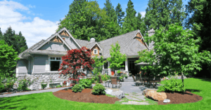 grey home with low-maintenance landscaping