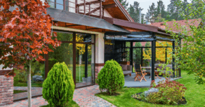 landscaping trend of a large outdoor patio that seamlessly integrates with a residential home