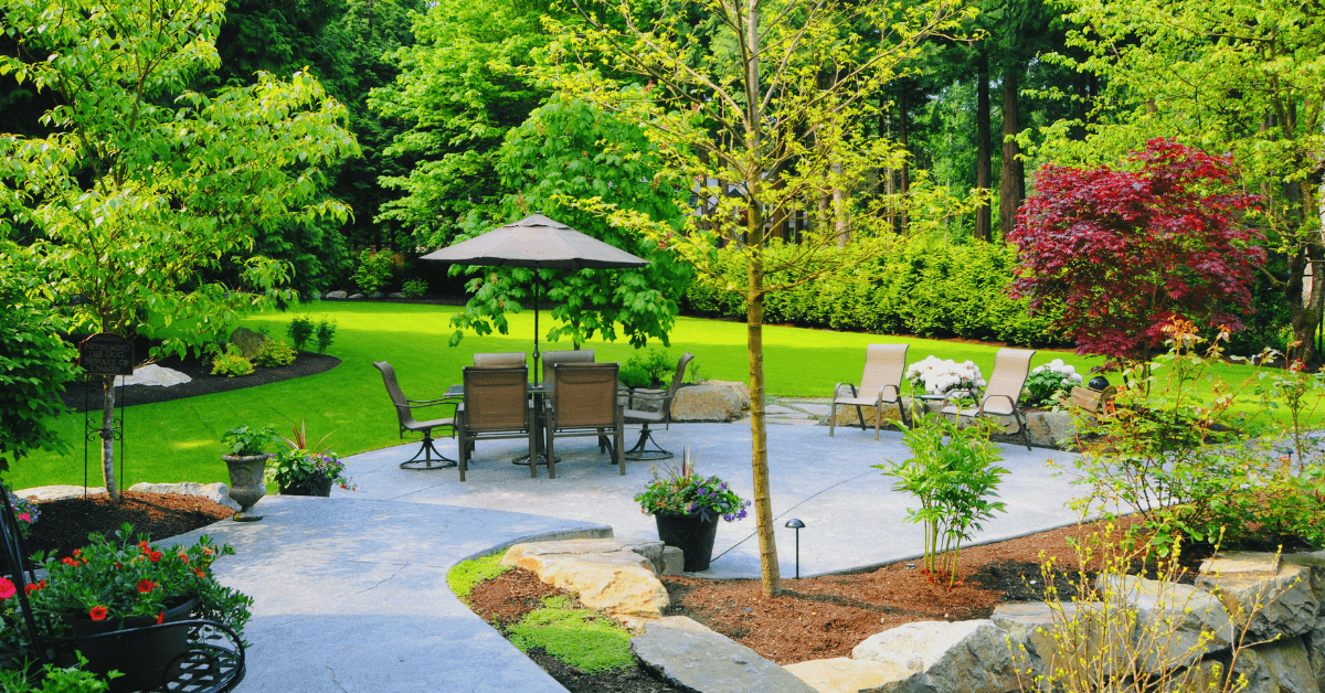 large stone patio in a backyard