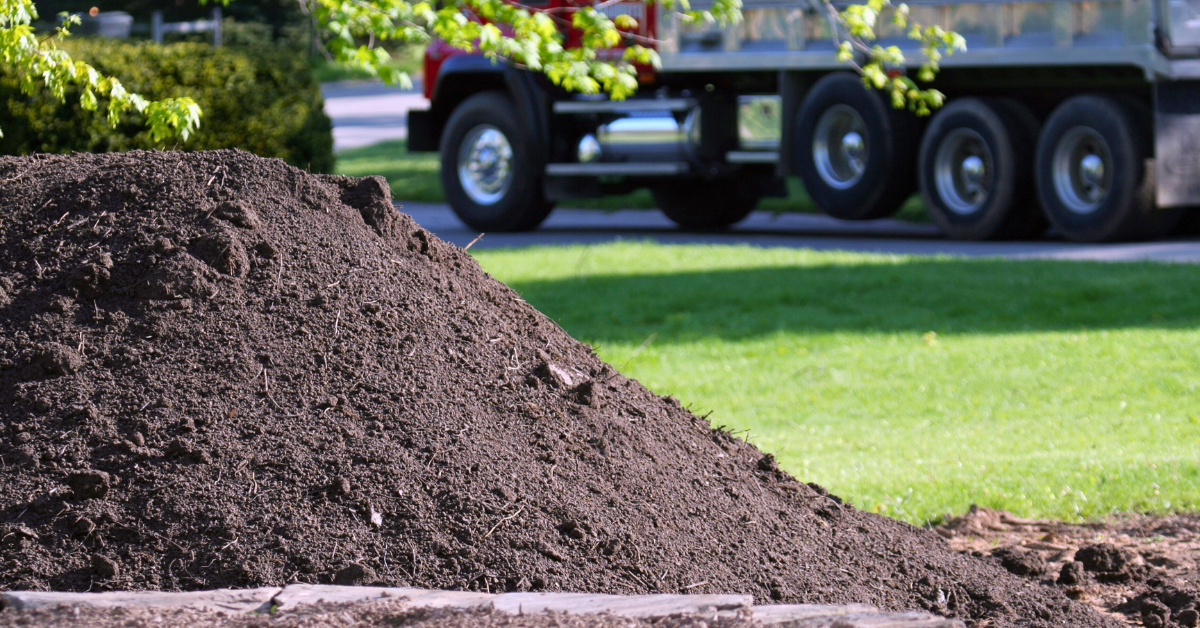 pile of topsoil that was delivered to a yard