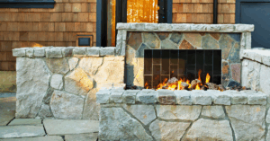 Small stone outdoor fireplace